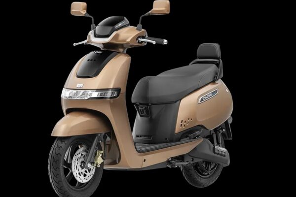 TVS iQube electric scooter parked on city road